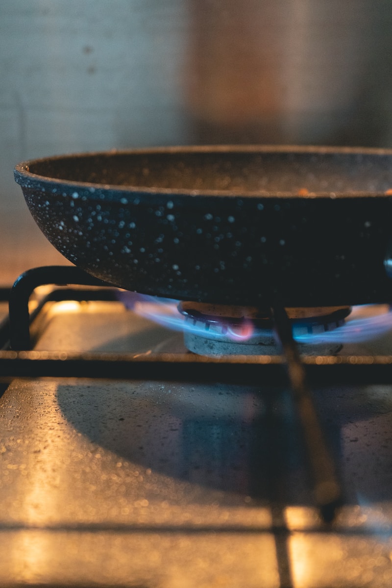 black cooking pan on stove