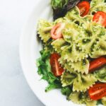 High protein pasta with chicken and vegetables in a white bowl