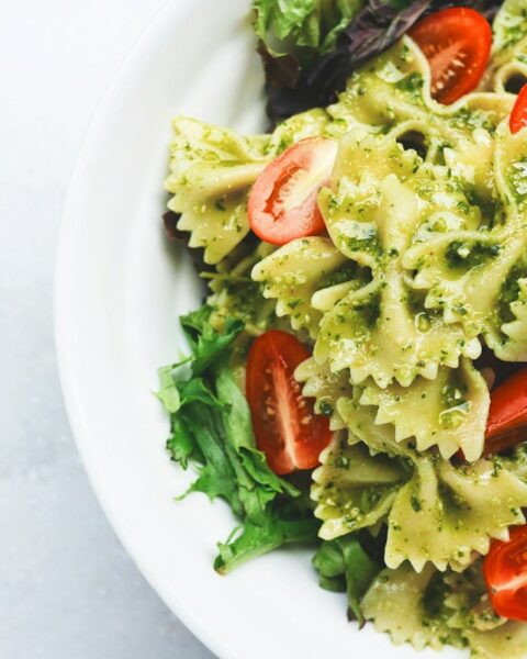High protein pasta with chicken and vegetables in a white bowl